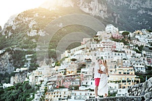 Romantic young couple in honeymoon in Positano, Amalfi coast, Italy