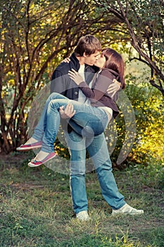 Romantic young couple kissing...