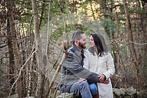 Romantic young couple in the New England woods