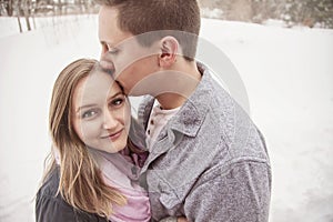 Romantic young couple outdoors in winter