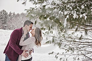 Romantic young couple outdoors in winter