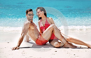 Romantic couple relaxing on a tropical beach