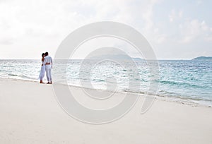 Romantic young couple on the sea shore