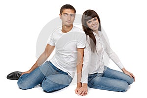 Romantic young couple sitting on floor