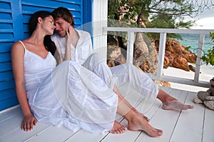 Romantic young couple in tropical beach house