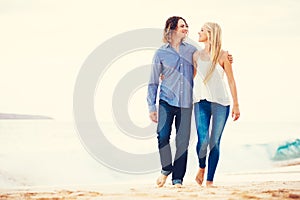 Romantic Young Couple Walking on the Beach