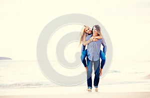 Romantic Young Couple Walking on the Beach