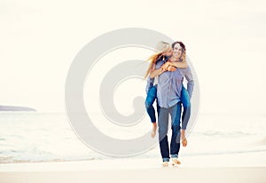 Romantic Young Couple Walking on the Beach