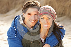 Romantic Young Couple On Winter Beach