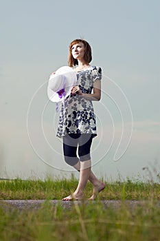 Romantic young girl is outdoors