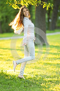 Romantic young girl outdoors enjoying nature Beautiful Model in