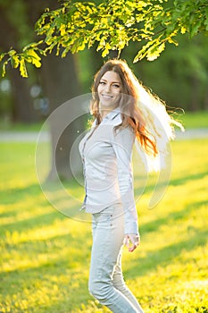 Romantic young girl outdoors enjoying nature Beautiful Model in