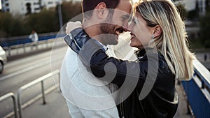 Romantic young happy couple kissing and hugging photo