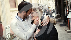 Romantic young happy couple kissing and hugging