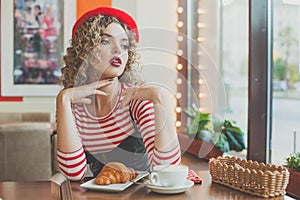 Romantic young woman in european cafee photo