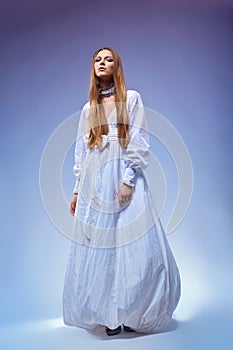 Romantic young woman in gown dress. Retro style