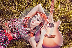 Romantic youth girl with her guitar, summer, hippie style