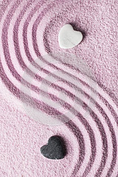 Romantic zen garden with two stone hearts