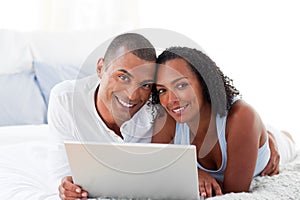 Romantice couple using a laptop photo