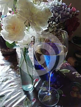 Romantique pastel  antique white roses and wine glass. photo