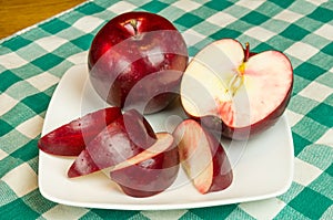 Rome Beauty apple slices on white plate