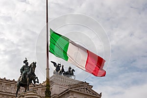 Rome - Italian national flag with scenic view on the front facade of Victor Emmanuel II monument on Piazza Venezia in Rome