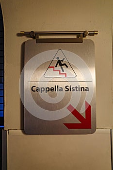 Rome, Italy - 27 Nov, 2022: Signs guiding Vatican Museum visitors towards the Sistine Chapel