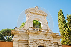 Rome, Italy - Angled view of the Farnese Gardens Horti Palatini during a clear sky afternoon and trees surrounding the area photo