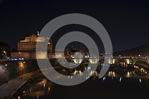 Rome Italy. Beautiful view of Castel Sant`Angelo and the bridge at night with reflections on the Tiber river