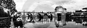 Panoramic black and white night view of Castle Saint Angelo in Rome, Italy