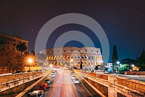 Rome, Italy. Bold Bright Dark Blue Night Starry Sky With Glowing Stars Above Colosseum Also Known As Flavian