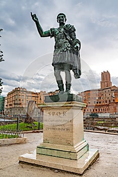 Rome, Italy. Bronze statue of Roman Emperor Caesari Nervae on Via dei Fori Imperiali street in the city. photo