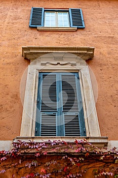 Rome, Italy. Closed windows and wooden shutters from outside homes/ houses/ apartments/ residences in Europe.