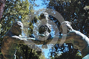 Rome, Italy - February 2020: Fonte gaia fountain bronze statue in Villa Borghese, lake garden