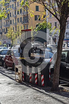 Rome, Italy, 25.12.2019: garbage box near the road downtown, a place for garbage in the city center. Centre Rome, Italy