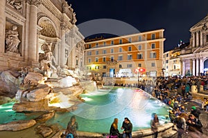 People at the Trevi Fountain in Rome at night, Italy