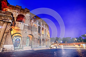 ROME, ITALY - JUNE 2014: The Colosseum and the homonymous square on a summer night