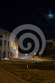 Rome, Italy - 24 June 2018: Night at the Great Roman Colosseum (Coliseum, Colosseo), also known as the Flavian Amphitheatre with