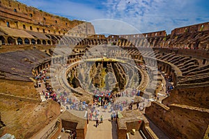 ROME, ITALY - JUNE 13, 2015: Roman Coliseum inside view, historical monument and turists walking around