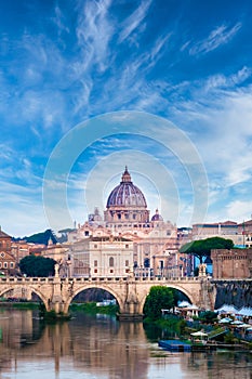 Tiber river bridge with Vatican City and dome of Saint Peter Cathedral - Rome, Italy