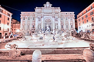 ROME, ITALY - JUNE 2014: Tourists enjoy the beautiful Trevi Fountain on a summer night
