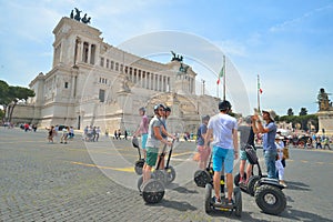 Rome, ITALY - JUNE 01: Tourists on segway in Piazza Venezia and Victor Emmanuel II Monument in Rome, Italy on June 01, 2016