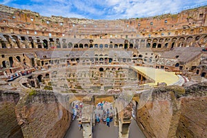 ROME, ITALY - JUNE 13, 2015: Tourists visiting the Roman Coliseum, inside view from the enter to the top