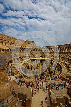 ROME, ITALY - JUNE 13, 2015: Vertical photo of the Roman Coliseum, inside view and people visiting this World Heritage