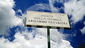 Marble street plaque of the Ponte della Musica-Armando Trovajoli. pedestrian bridge dedicated to the Italian pianist, composer and photo