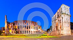 Rome, Italy: Night view of  The Arch of Constantine next to the Colosseum after sunset over a blue sky