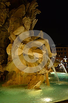 Rome, Italy, night view baroque water fountain at Piazza Navona