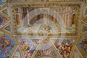 Rome, Italy - 27 Nov, 2022: Frescoes in the wall and ceiling of one of the Rafael Rooms in the Vatican Museums