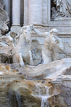 18th century Trevi Fountain, character of triton with a horse, Rome, Italy photo