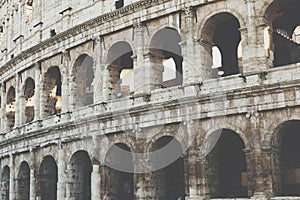 Rome, Italy.One of the most popular travel place in world - Roman Coliseum under evening sun light and sunrise sky.